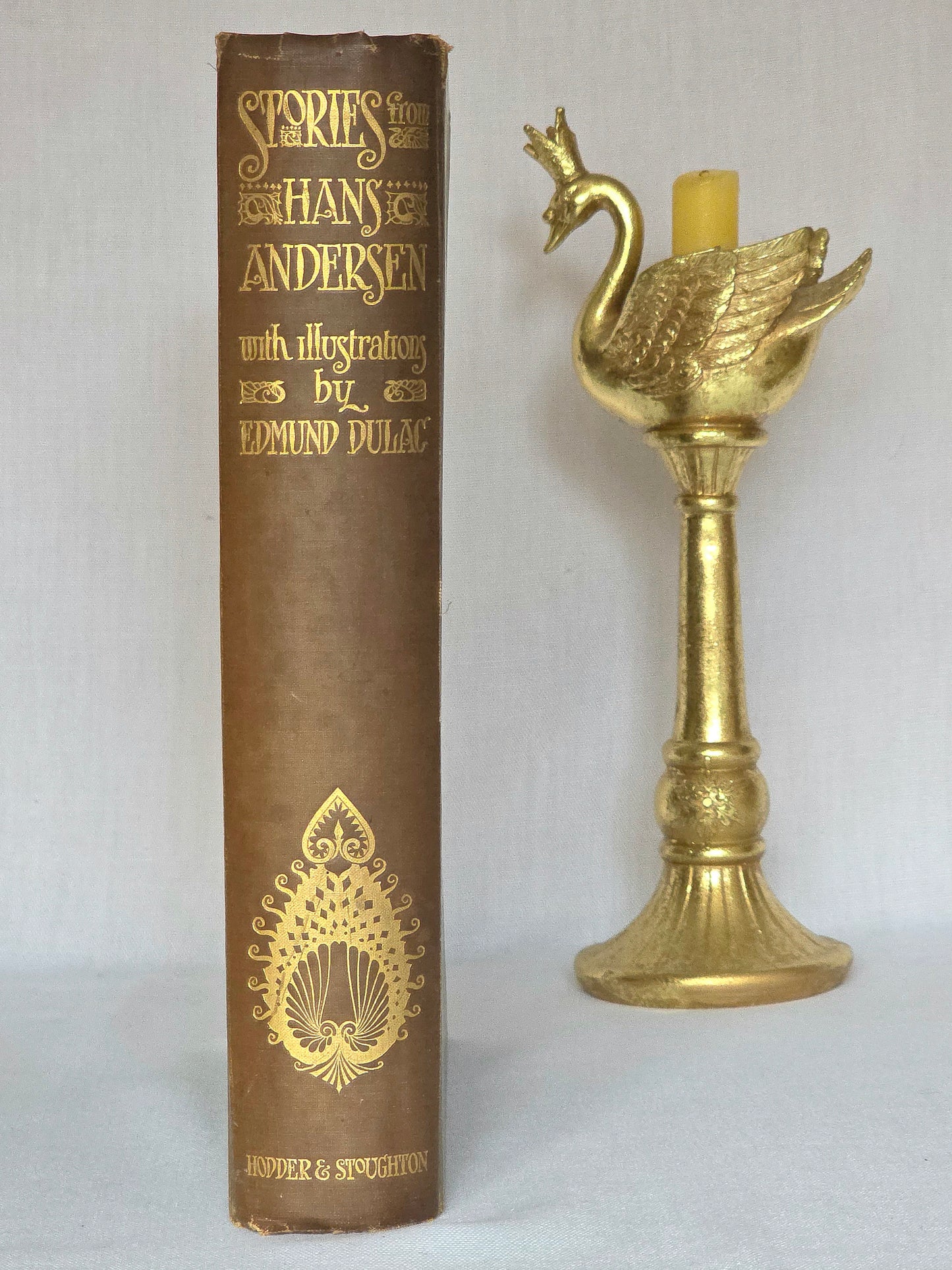 Decorative antique book in green cloth with gilt decoration, titled 'Stories from Hans Andersen' with illustrations by Edmund Dulac.