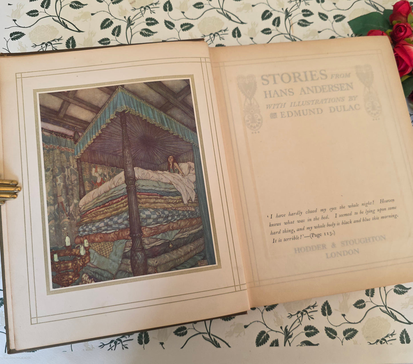 Open antique book showing frontispiece by Dulac and title page 'Stories from Hans Andersen'.