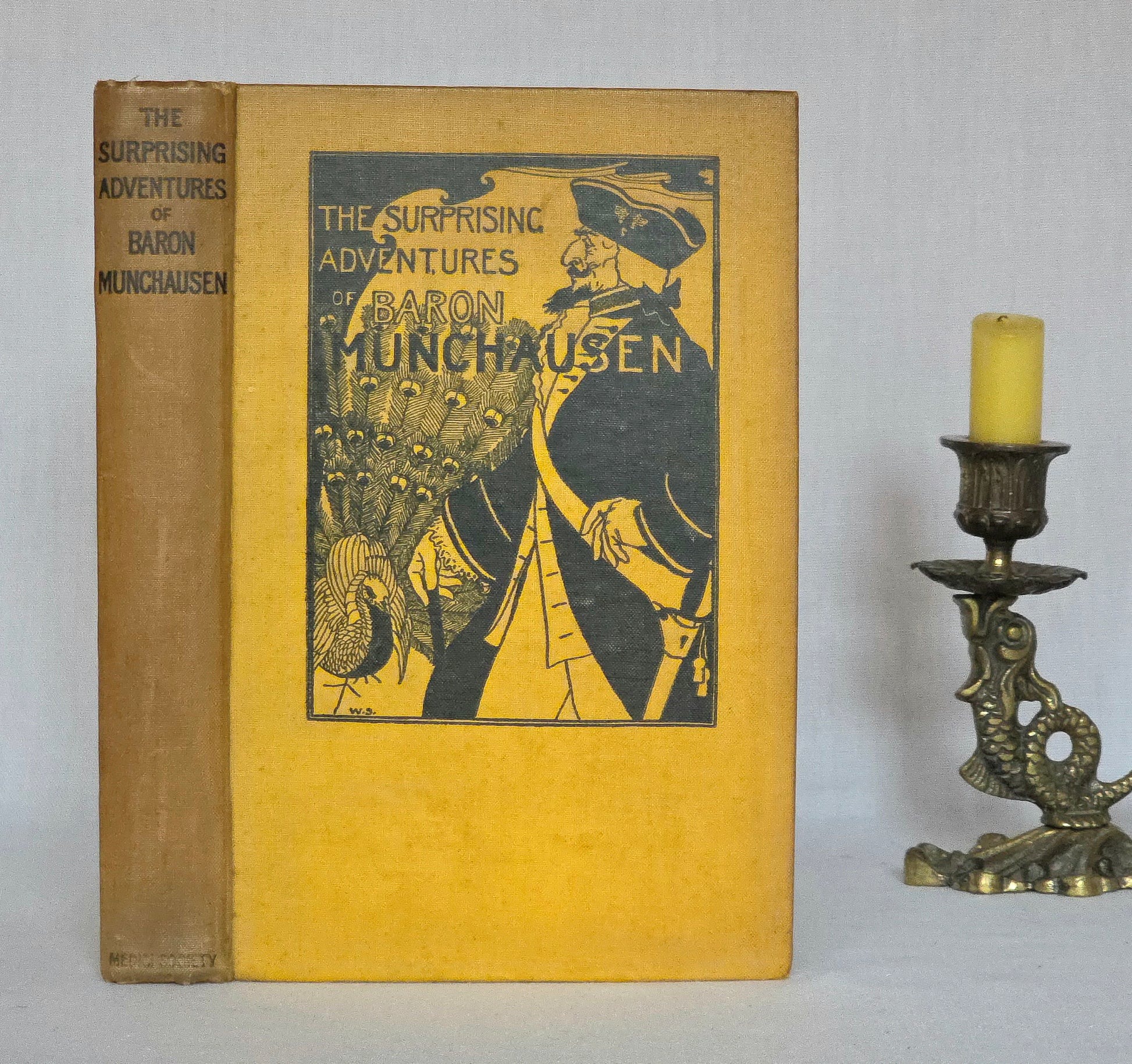 Vintage book titled 'The Surprising Adventures of Baron Munchausen' by The Medici Society