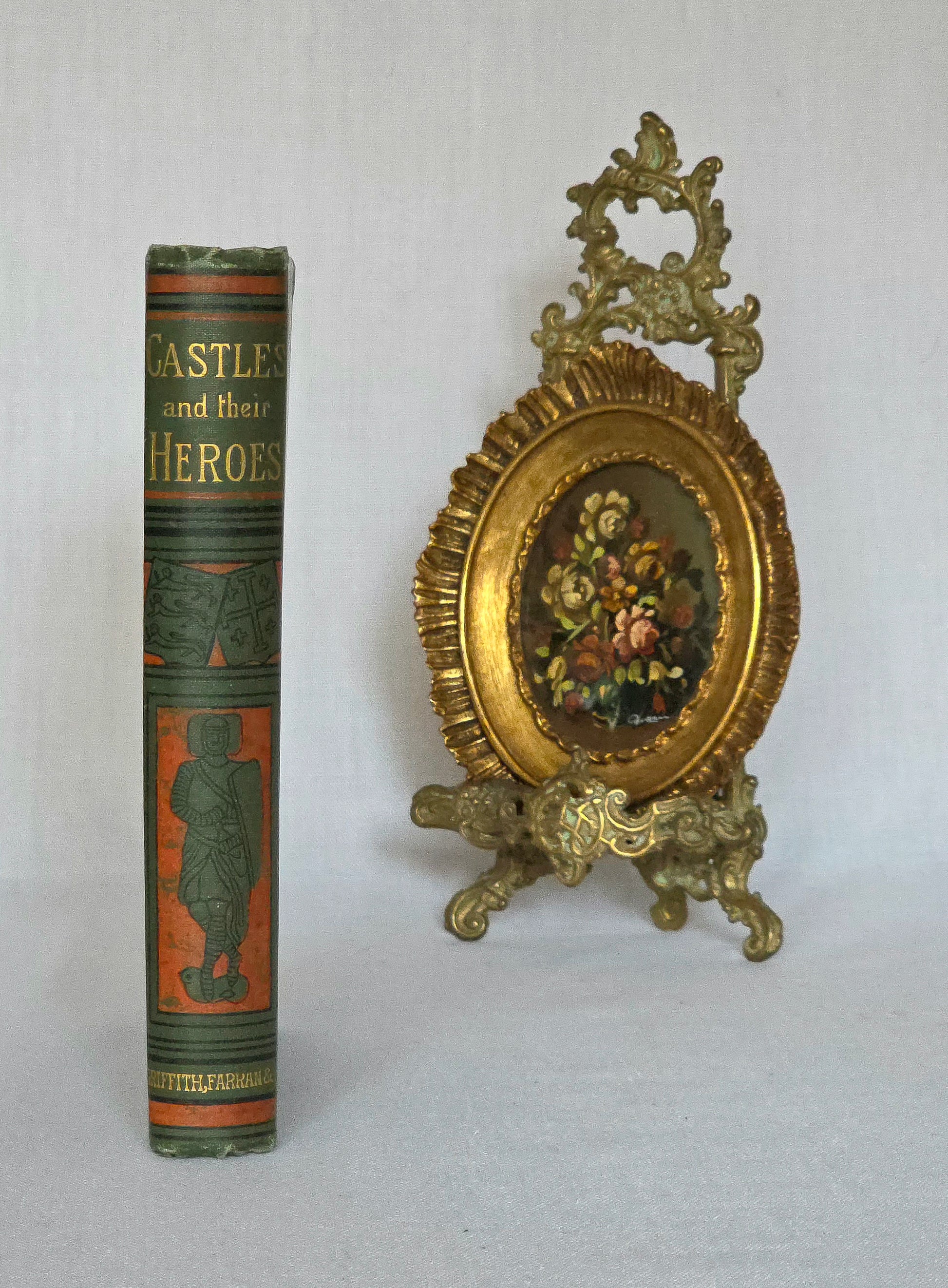 Vintage book titled 'Castles and their Heroes' depicting a medieval knight, Griffith Farran & Co. London