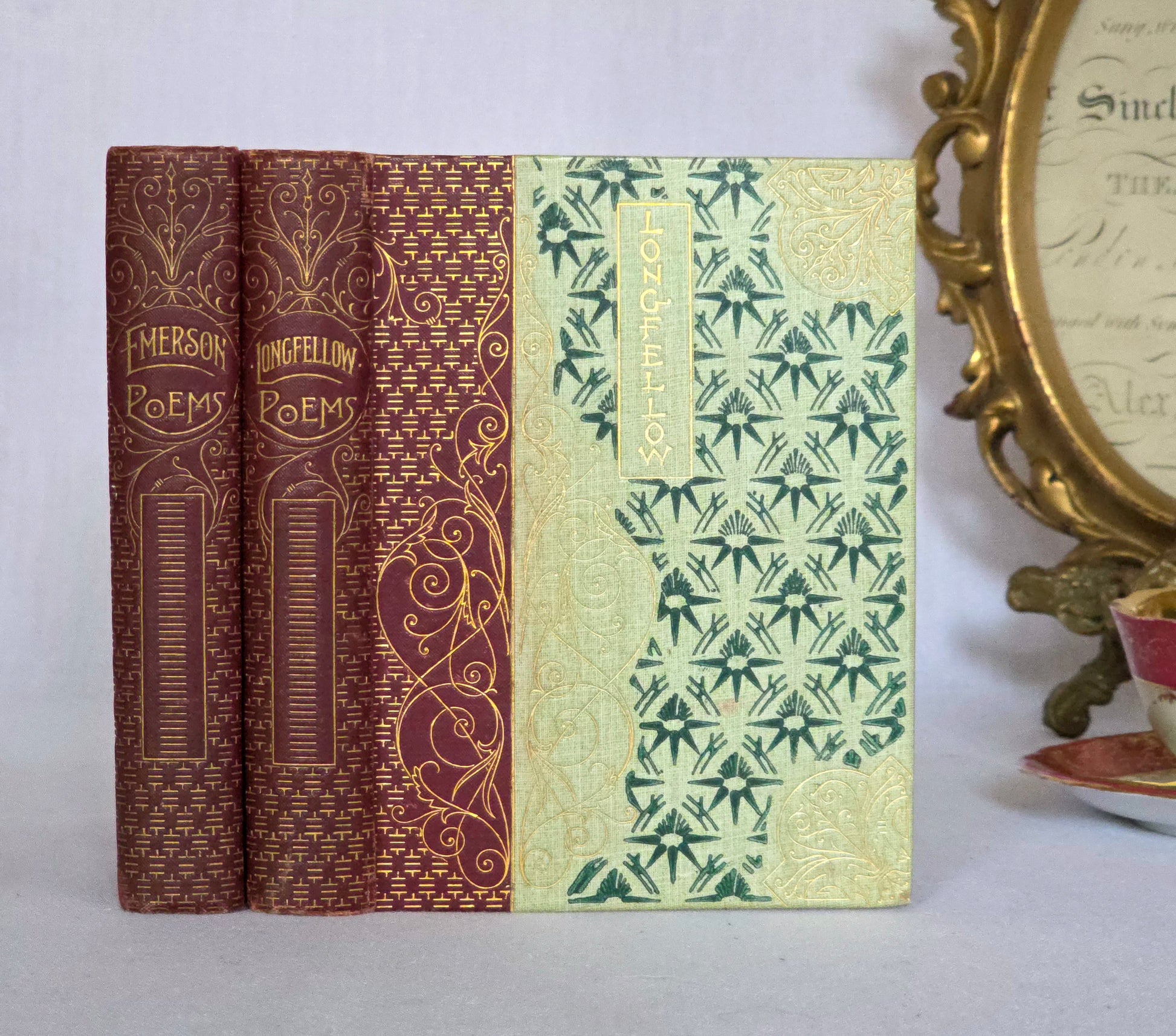 Two antique poetry books with decorative covers in a Chinoiserie and Art Nouveau style, Longfellow and Emerson in the Walter Scott Library 