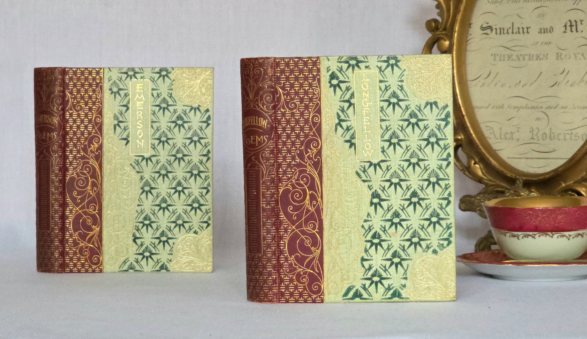 Two antique poetry books with decorative covers in a Chinoiserie and Art Nouveau style, Longfellow and Emerson in the Walter Scott Library 