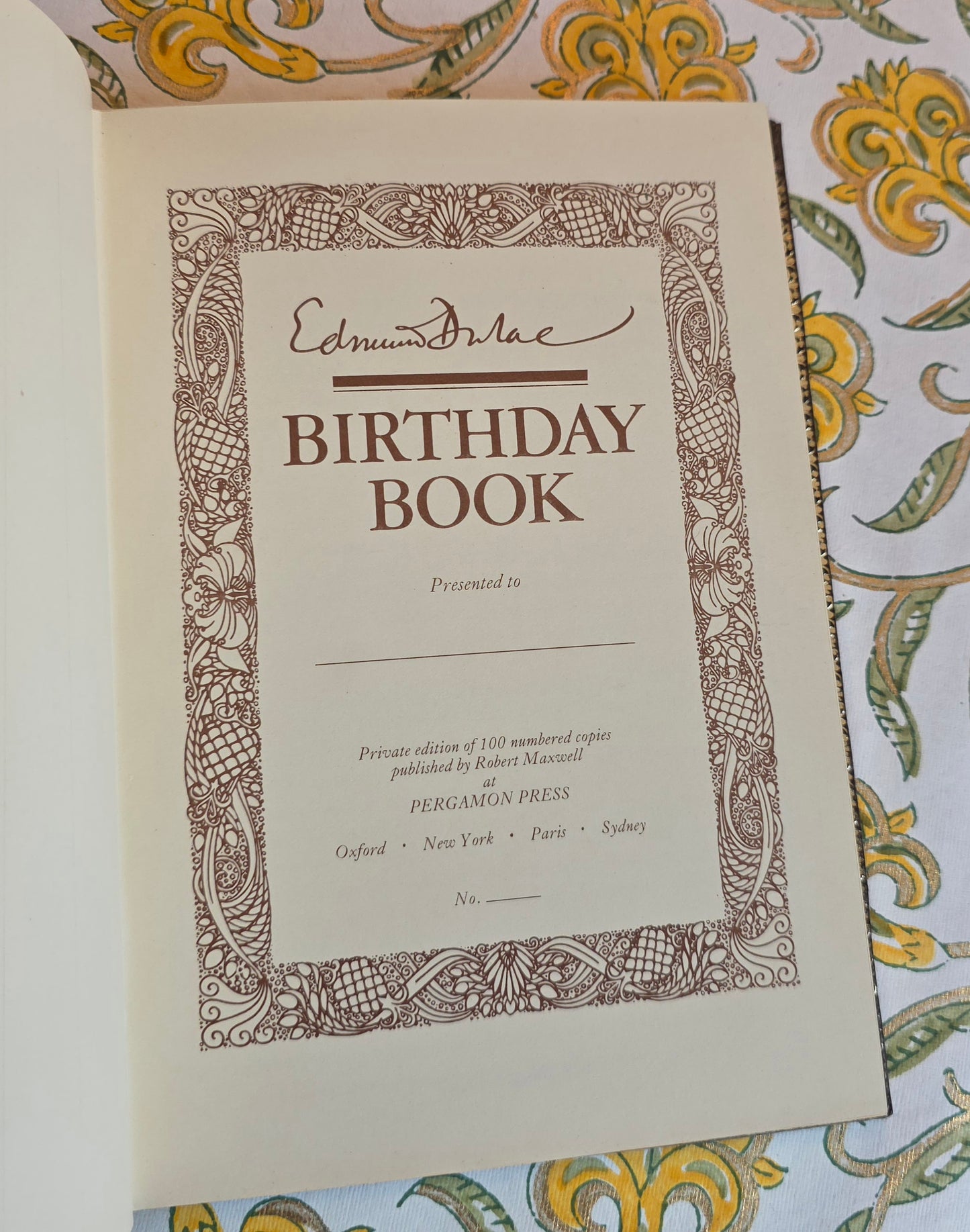 Vintage book open at title page of Edmund Dulac's Birthday Book