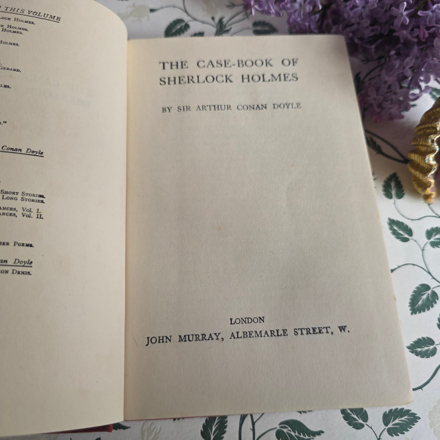 Vintage book opens at title page of The Case-Book of Sherlock Holmes by Conan Doyle