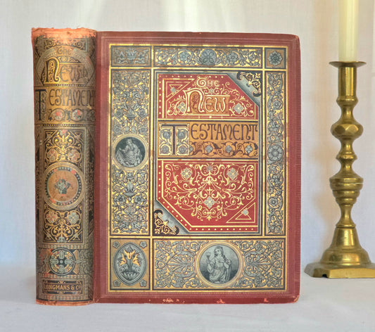 Decorative antique Bible with ornate cover design on a white background