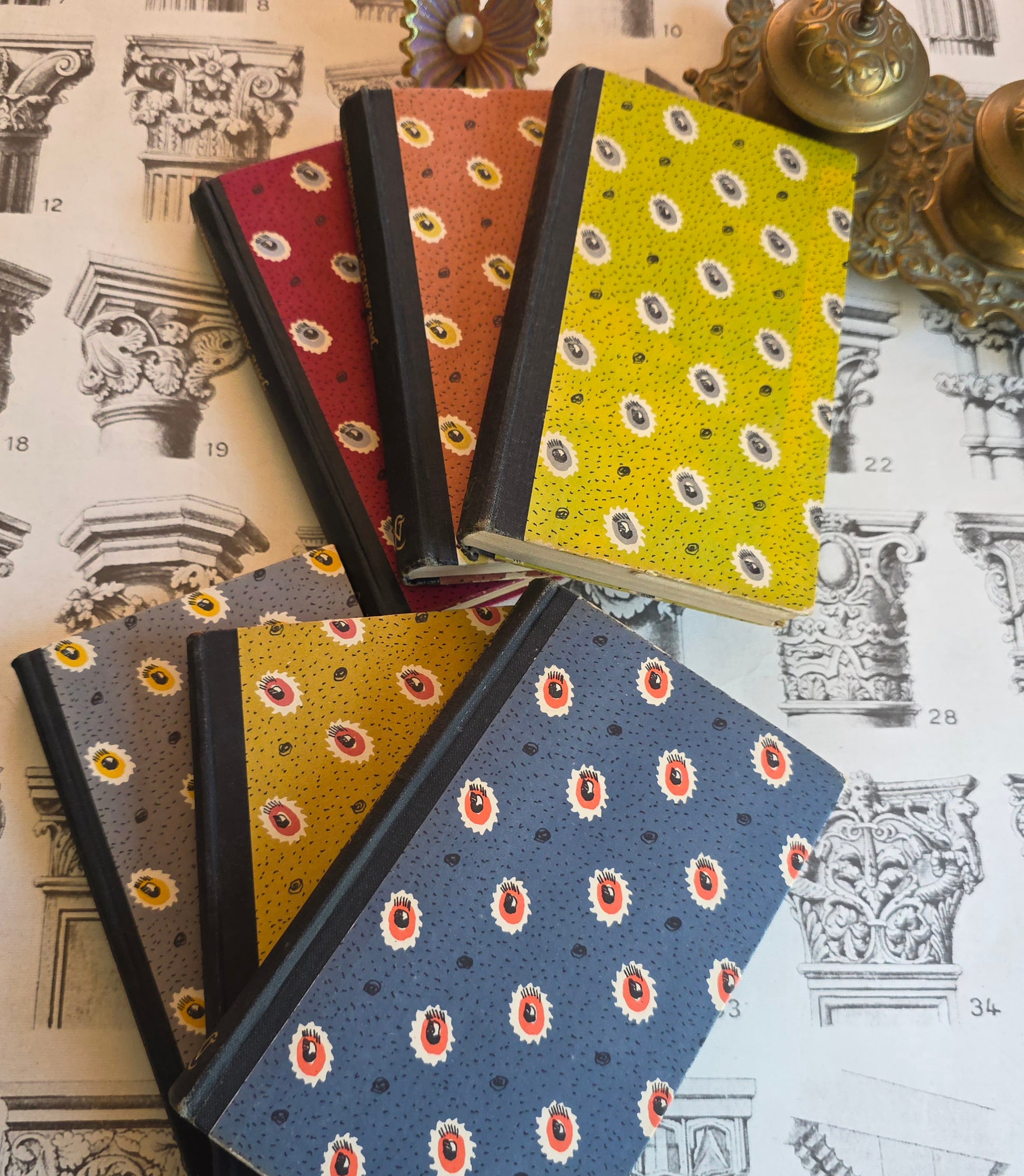 Set of patterned vintage Jane Austen novel books on a decorative background