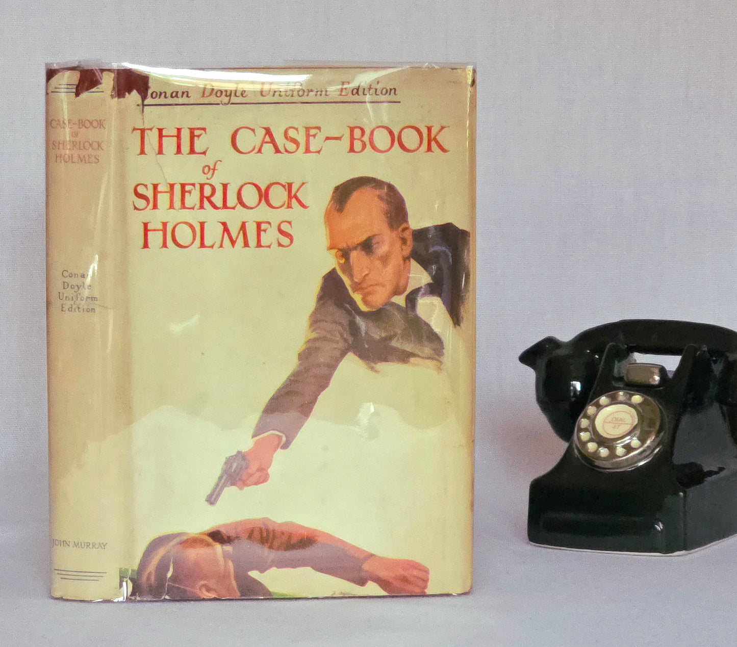 Vintage book in dust wrapper with the title The Case-Book of Sherlock Holmes by Conan Doyle
