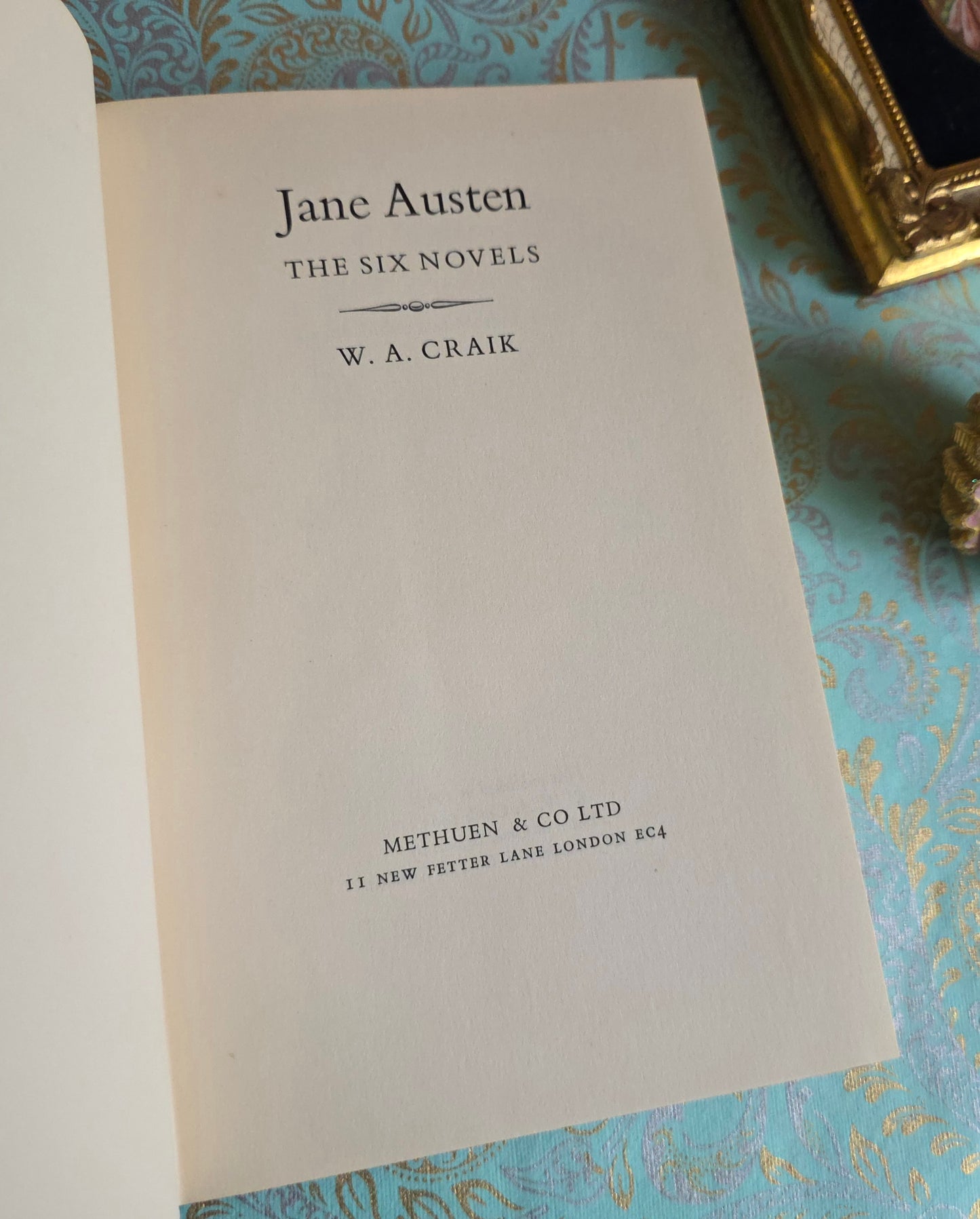 Book open at title page of 'The Six Novels' by Jane Austen by WA Craik.