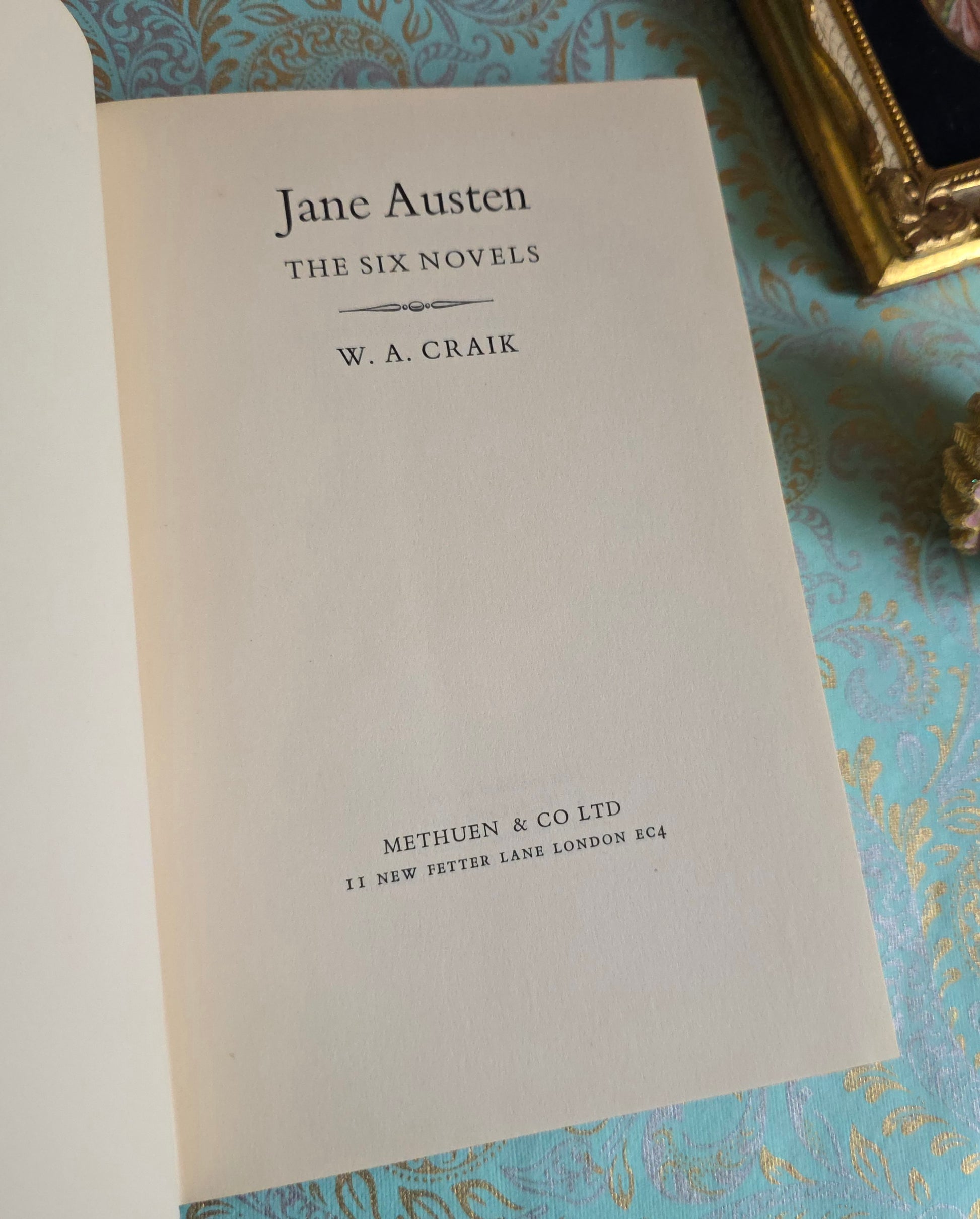Book open at title page of 'The Six Novels' by Jane Austen by WA Craik.
